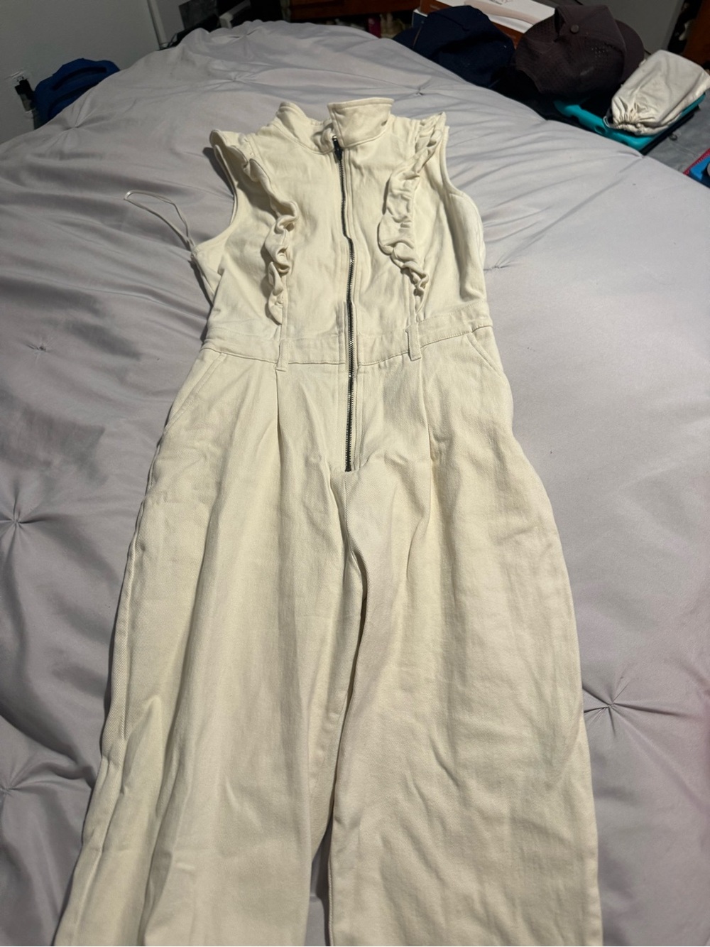 Sleeveless Ruffle-Trim Zip Jumpsuit in Cream